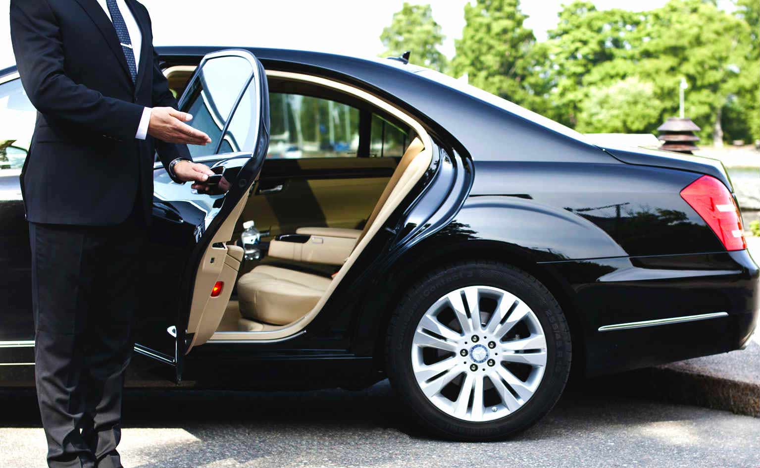 man holding a car door open